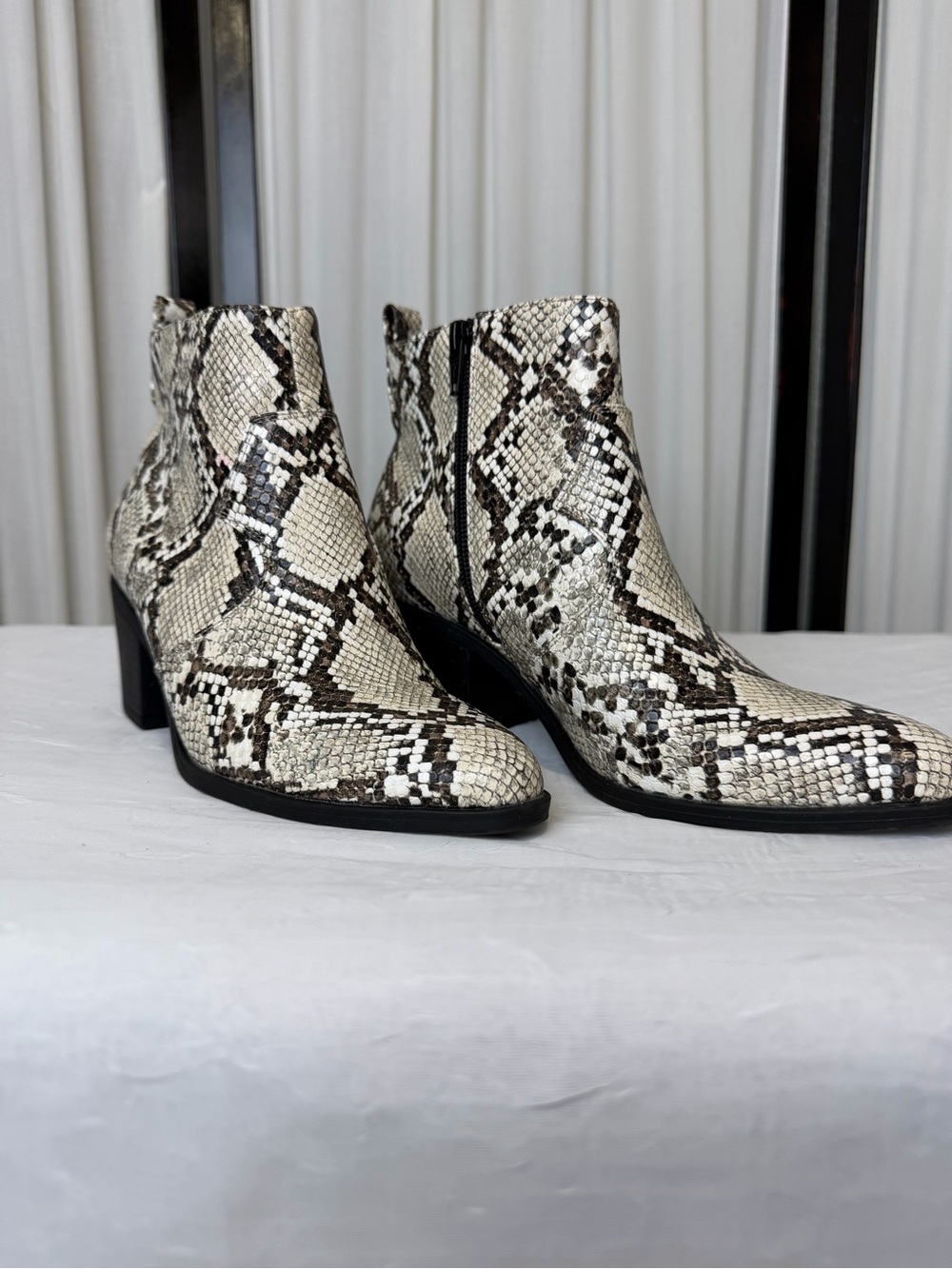 Snake-Print Ankle Booties in Ivory and Black